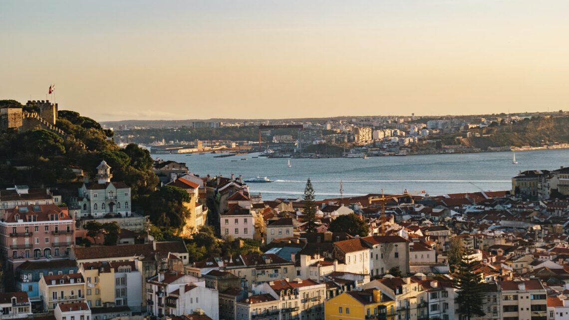 Lisbon's skyline with the sunset over the Tagus River.